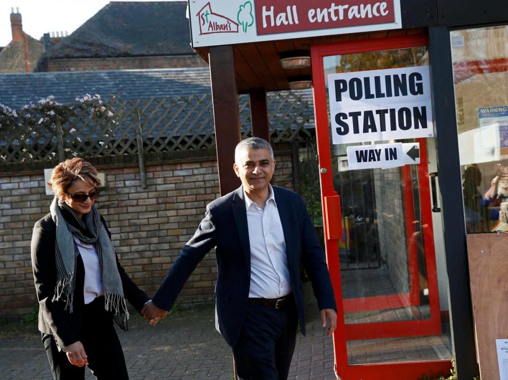 Khan, Britain's Labour Party candidate for Mayor of London and his wife Saadiya leave after casting their votes for the London mayoral elections